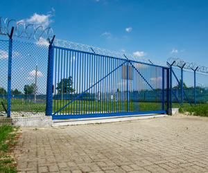 Security fence with sliding gate